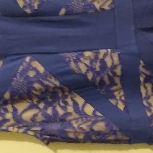 blue long dress. lace on front and back of the top. earrings to match